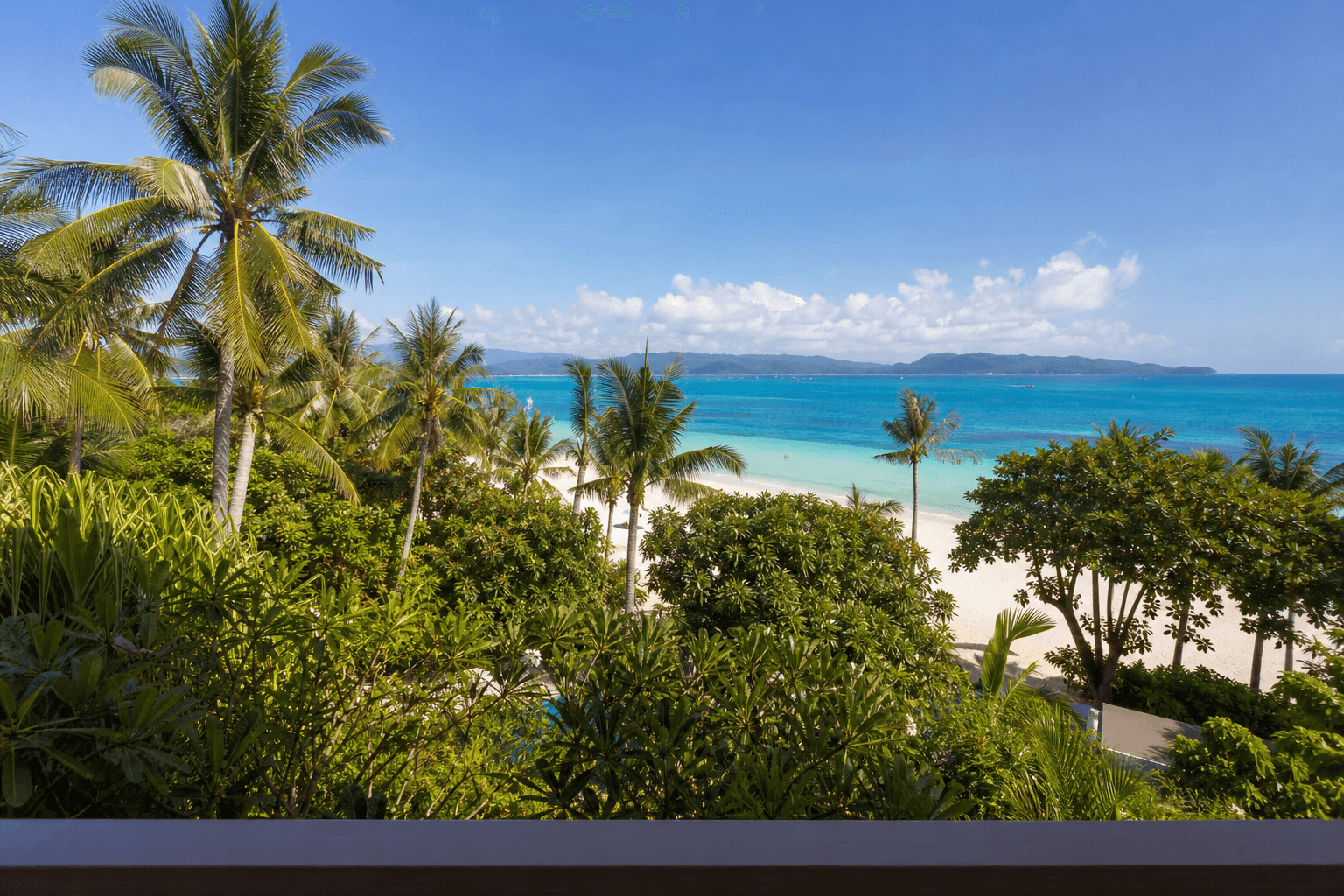 Family Suite balcony view across palms to the sea